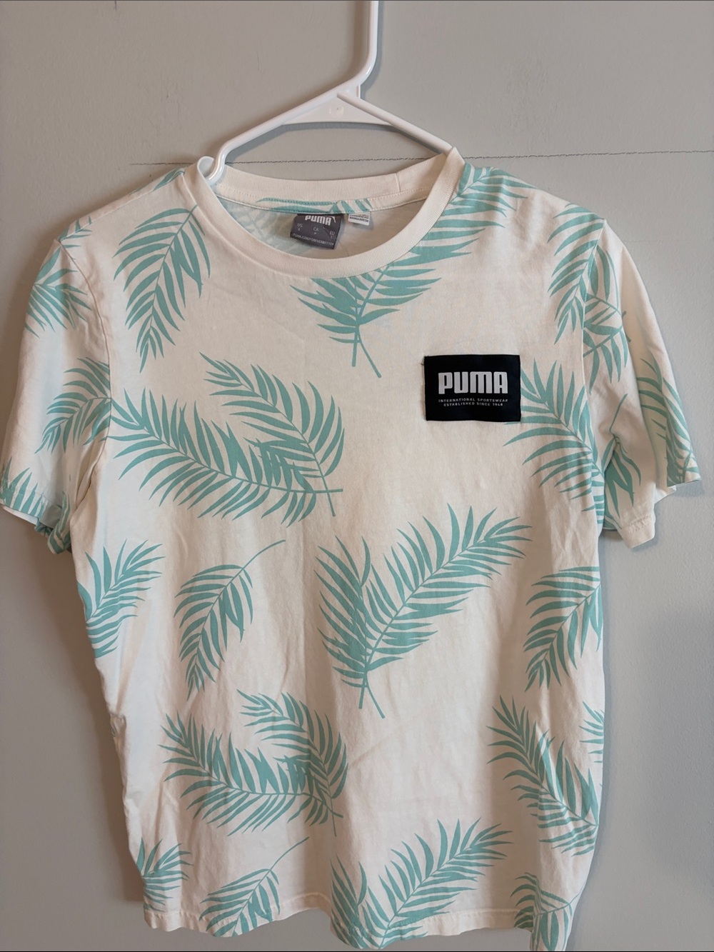 Puma off White Tee with Mint Palm Print. Small 80% cotton/20 poly.